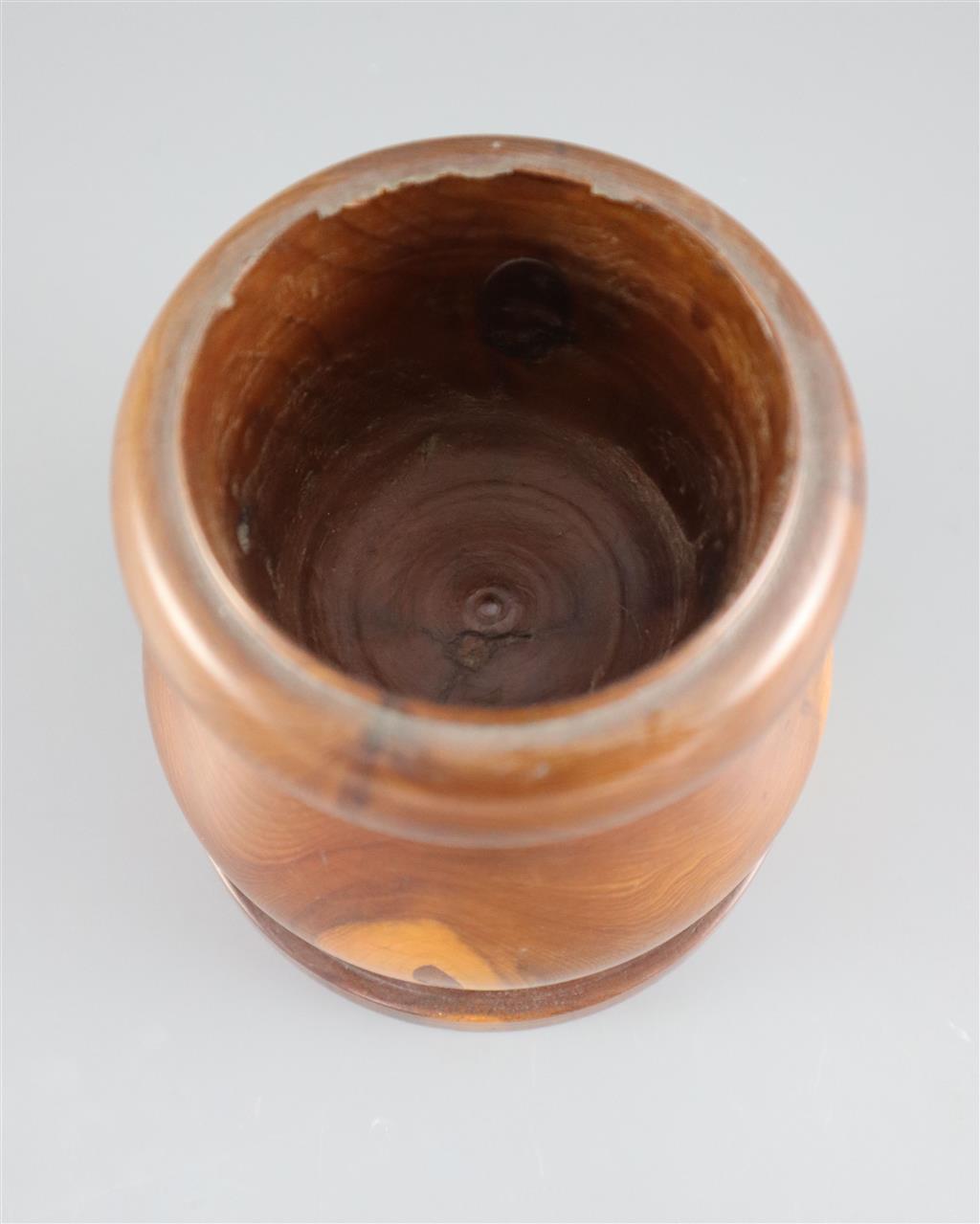 A late 18th / early 19th century turned yew wood pestle and mortar, pestle 9in. mortar height 5in.